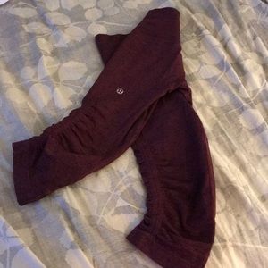 In the flow crop maroon lululemon pants